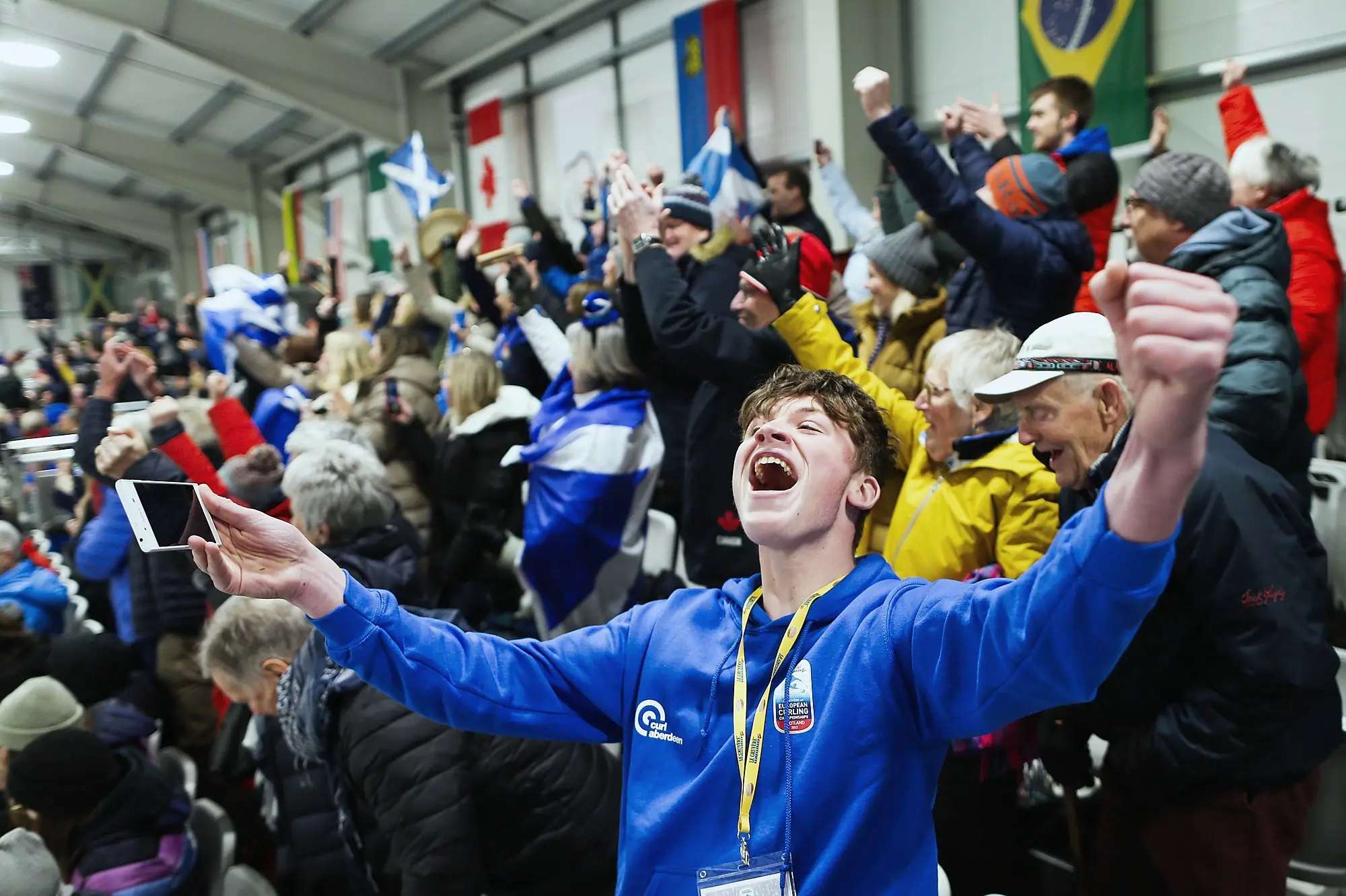 The crowd celebrating at an international event