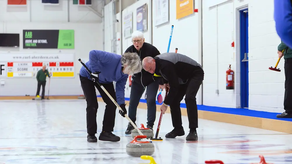 Curlers sweeping at Curl Aberdeen
